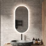 Moderne ovale badkamerspiegel met vele opties, zoals: dimbare verlichting met instelbare lichtkleur en spiegelverwarming