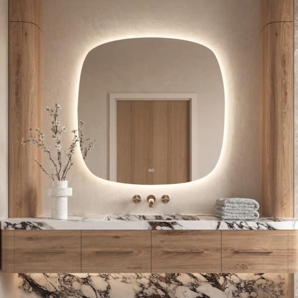 Deze trendy Deens ovale badkamerspiegel is 100x100 cm en van alle gemakken voorzien, zoals: dimbare verlichting, spiegelverwarming en een dubbele touch schakelaar voor oa het instellen van de gewenste lichtkleur