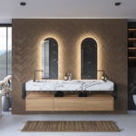 Beschik je over een breed badkamermeubel met 2 kranen of over 2 losse badkamermeubels? Denk dan eens aan 2 spiegels naast elkaar